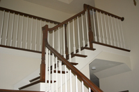 Painting MA - Image of foyer stairs, stained handrailed, painted ballusters